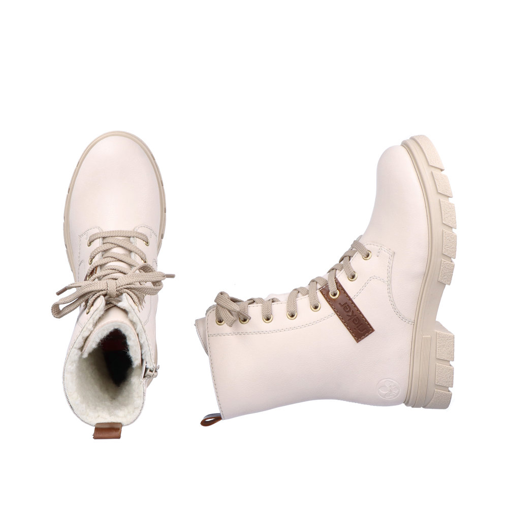 фото Утепленные ботинки молочного цвета из натуральной кожи rieker